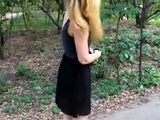 Girl walks in the Park with naked booty