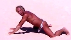 Tanned guy on beach in tiny string thong (temporarily!)