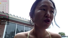 Asian enjoys outdoor masturbation