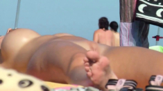 Nudist beach voyeur vid with a hot brunette